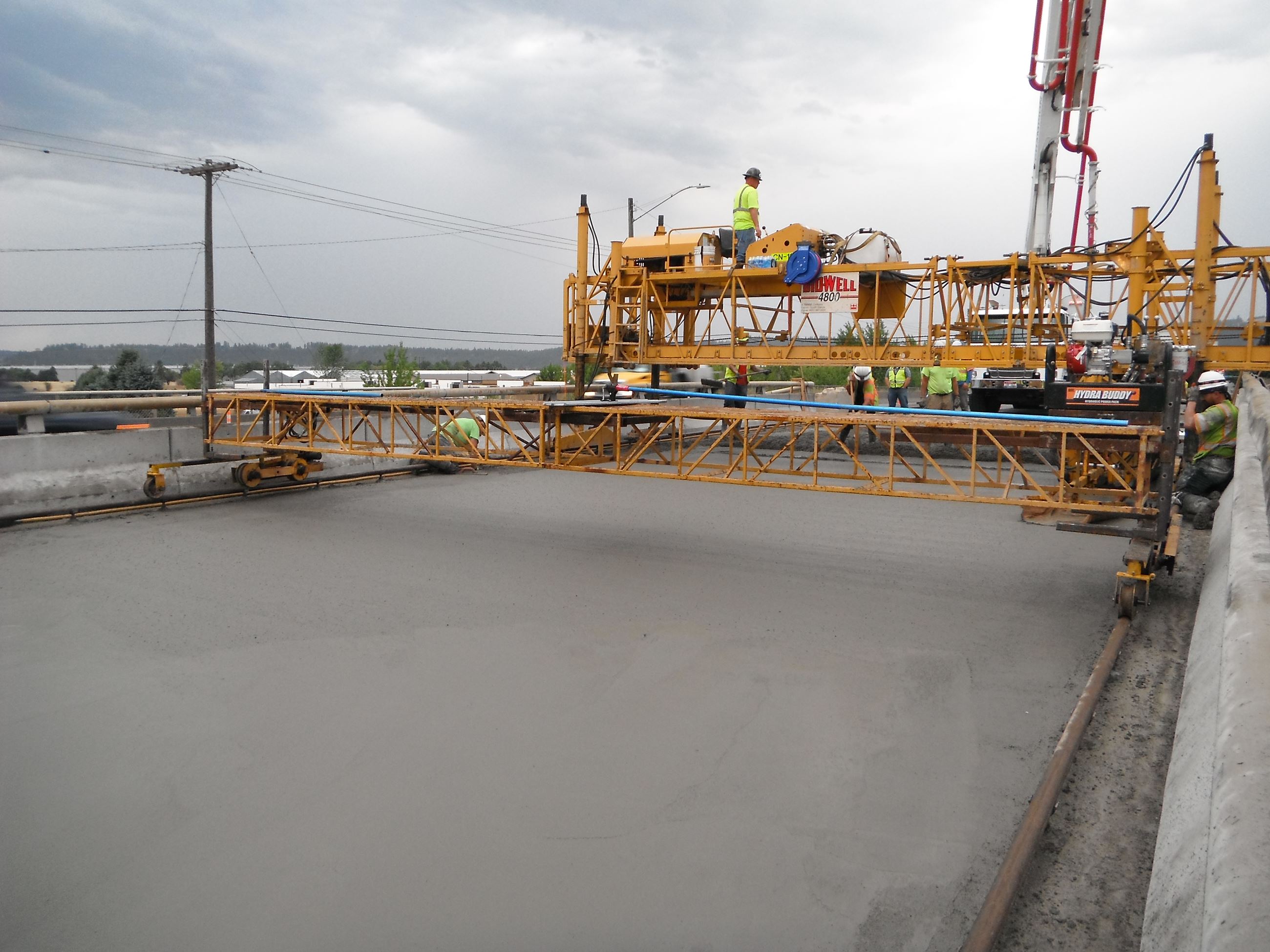 Concrete deck resurfacing on bridge in the process of completion.