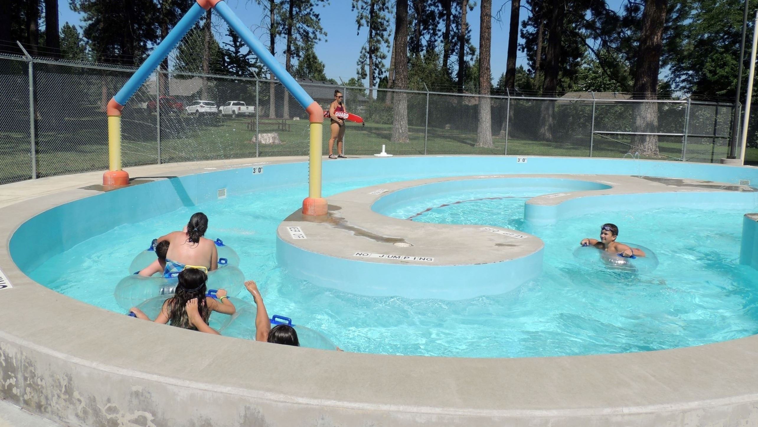 Pool patrons floating on a lazy river at the Terrace View Pool